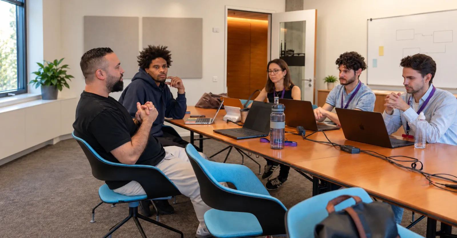 Daniel Keller running a workshop around a table